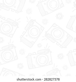 Seamless pattern with vintage hipster cameras. Hand-drawn illustration.