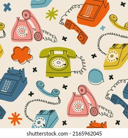 Seamless pattern with vintage telephones.  Flat vector pattern wallpaper with retro gadgets for textile and fabric. Isolated dial telephone, wireless telephone, phone systems, handset, desk phone.