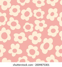 seamless pattern with vintage vector groovy flowers. modern elements. stylized flowers silhouettes on a light pink background. surface design, textile, stationery, wrapping paper and covers