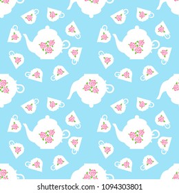 Seamless pattern. Vintage white porcelain teapot and cups with rose picture on light blue background.