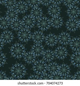 Seamless pattern. Wallpaper of snowflakes. Dark green, blue and light green.