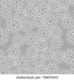 Seamless pattern. Wallpaper of snowflakes. Different of tones gray.