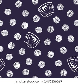 Seamless pattern with walnuts and bowl in white on a ground of midnight blue.
