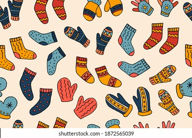 Patrón incomparable de calcetines calientes y mitones de punto. Ilustración del doodle dibujada a mano por vectores. Invierno. Frío. Ropa cálida