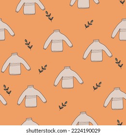 A seamless pattern warm sweaters and leaves 