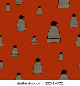 seamless pattern of warm winter hats with bubo