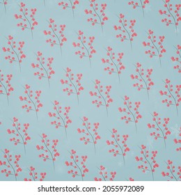 seamless pattern with watercolor New Year symbols of the year, berries, viburnum, snowflakes. On an isolated blue background