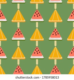Seamless pattern with watermelon and orange ice cream bars isolated on a green background