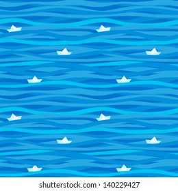 Seamless pattern with waves and paper boats.