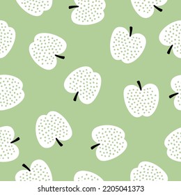 Seamless pattern with white apples and green background