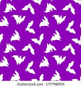 Seamless pattern of white bats. White bats on a purple  background.A nice pattern for Halloween. Design for paper, scrapbooking, printing. Vector illustrations