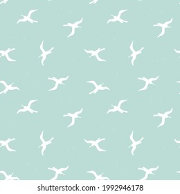 Seamless pattern with white birds on turquoise background. Silhouettes of seagulls flying in the sky. Vector colored endless texture for your designs packing, cards, wrapping paper, textile, towels