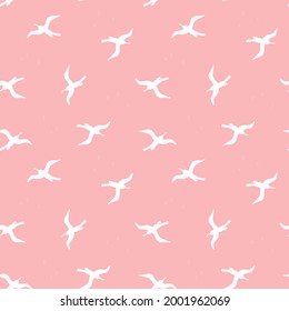 Seamless pattern with white birds on pink background. Silhouettes of seagulls flying in the sky. Vector colored endless texture for your designs packing, cards, wrapping paper, textile, towels