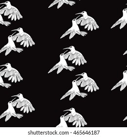 Seamless pattern with white birds on a black background, vector