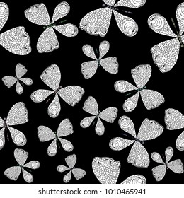 Seamless pattern with white and black butterflies 