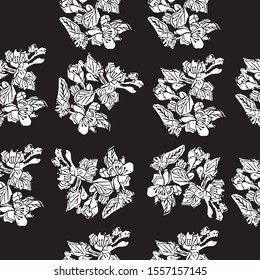 Seamless pattern of  white  blossoming branch of apple tree flowers on black background. Hand made linocut. Vector illustration.