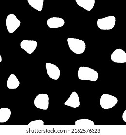 Seamless pattern of white blots on a black square background. Texture paper for collages. Used for printing on paper, fabric, packaging, wallpaper. Eps10.