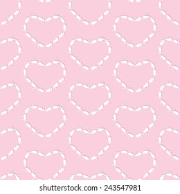 Seamless pattern with white bunnies with dark pink shadows lying in the shape of hearts isolated on light pink background. For wallpaper, wrapping paper, textile decoration