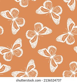 Seamless pattern with white butteflies and brown background