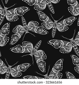 Seamless pattern with white  butterflies. Hand drawn doodle. Vector illustration