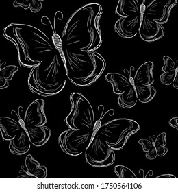 Seamless pattern with white butterflies on a black background. Freehand drawing.