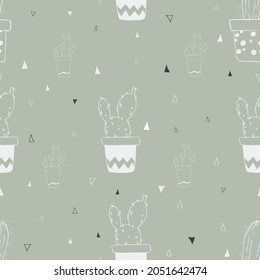 Seamless pattern with white cacti on a green background.