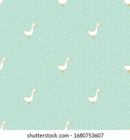 Seamless pattern. White cartoon geese on a turquoise background with dots.