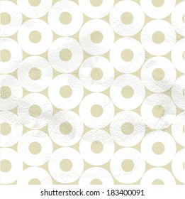 Seamless pattern of white circles on beige paper. Vintage background