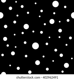 Seamless pattern with white circles on a black background. Polka dot. circles of different sizes.