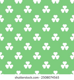 Seamless pattern of white clover leaves isolated on green background for Saint Patrick's Day.