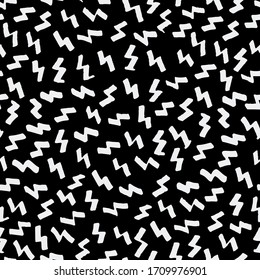 Seamless pattern. White color lightnings which reminds various ornament pattern in the black background.Transformation of ink stains. For textile, paper or fabric industry, backgrounds. Vector