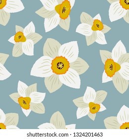 Seamless pattern with white daffodils on a blue background. Floral background. Vector illustration.