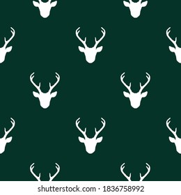 Seamless pattern with white deer heads. Vector nature wildlife animal background. Hunting trophy dark green backdrop.
