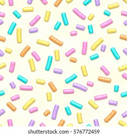 Seamless pattern of white donut glaze with many decorative sprinkles.