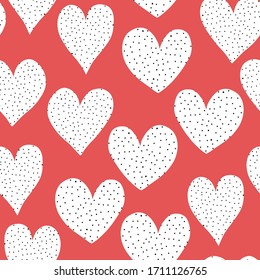 Seamless pattern white doodle hearts with black dots on red background. Hand drawn cute heart shapes repeating Valentines day illustration. Use for wrapping, packaging, kids fabric, wedding