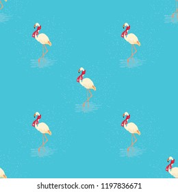 Seamless pattern of white flamingo in a red scarf standing in water on one leg in winter. Vector illustration of exotic bird on blue background. Wildlife concept.