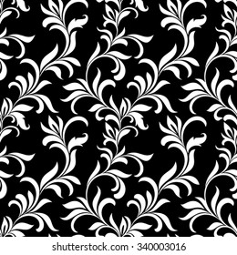 Seamless pattern with white floral tracery on a black background