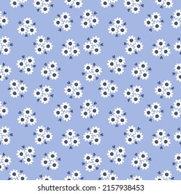 Seamless pattern with white flowers and blue background