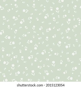 Seamless pattern with white flowers and green background