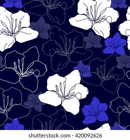 Seamless pattern with white flowers on a blue background. Hand drawn floral texture.