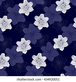Seamless pattern with white flowers on a blue background. Hand drawn floral texture.