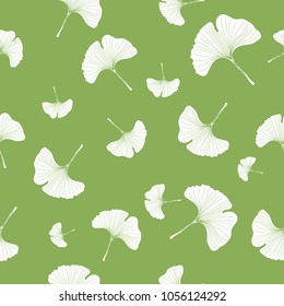 Seamless pattern white ginkgo leaves on green background.printing wallpaper.vector illustration