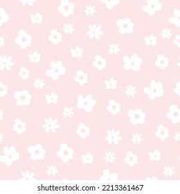 Seamless pattern of white hand drawn daisies in doodle style on a pink background. Romantic print for fabric, paper, t-shirt.