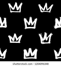 Seamless pattern and white hand  drawn crowns isolated black background  Rough brush painted shapes vector backdrop  Doodle style abstract grunge texture  
