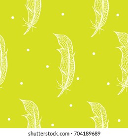 Seamless pattern white hand-drawn feathers on a green background. Vector