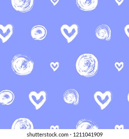 Seamless pattern with white hand-drawn hearts and round brush strokes isolated on blue background. Ink doodle style abstract grunge texture.
