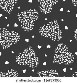 Seamless pattern with white hearts on dark background. Branches with leaves in the heart. Romantic Wallpaper, textiles, clothing, wrapping paper. Monochrome illustration.