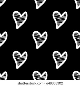 Seamless pattern with white hearts on black background  in a scribble, doodle style