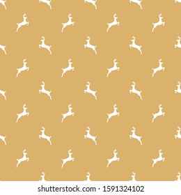 Seamless pattern with a white silhouette of the deer on golden beige background.