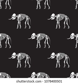 Seamless pattern. White skeleton of an elephant on a black background. Great for tattoo and printing on a T-shirt. Ideal for decoration of Halloween and the Day of the dead.